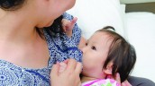 Mother with child breastfeeding