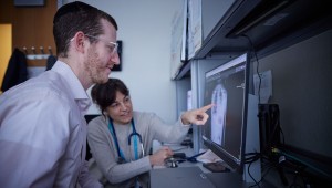 Clinicians examining chest x-ray