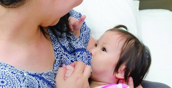 Mother with child breastfeeding