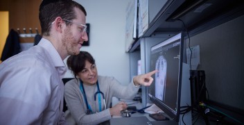 Clinicians examining chest x-ray
