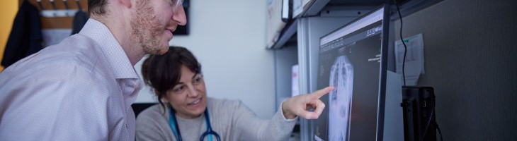 Clinicians examining chest x-ray