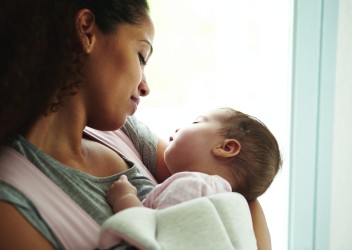 mother holding infant