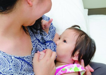 Mother with child breastfeeding