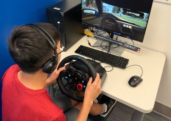Male teen using CHOP's Virtual Driving Assessment